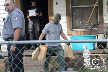  Officers were seen removing evidence bags from the house located on McLaughlin Street