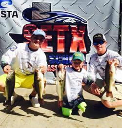 Jared Wiggins and Brett Clark with their Day Two catch, along with their biggest fan, Brandt Wells.