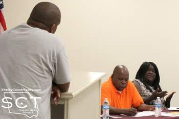 Natalie Harris (far right), councilwoman, is seen speaking with Dewayne Reese (left) about his park and financial concerns involving Tenaha..