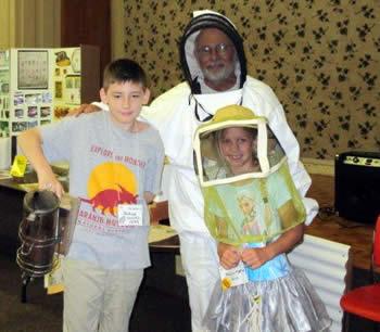 Joshua Woods, a 5th grader at Hemphill and Kahlen Morton, a 3rd grader at Hemphill helped to demonstrate the various equipment in Beekeeping.